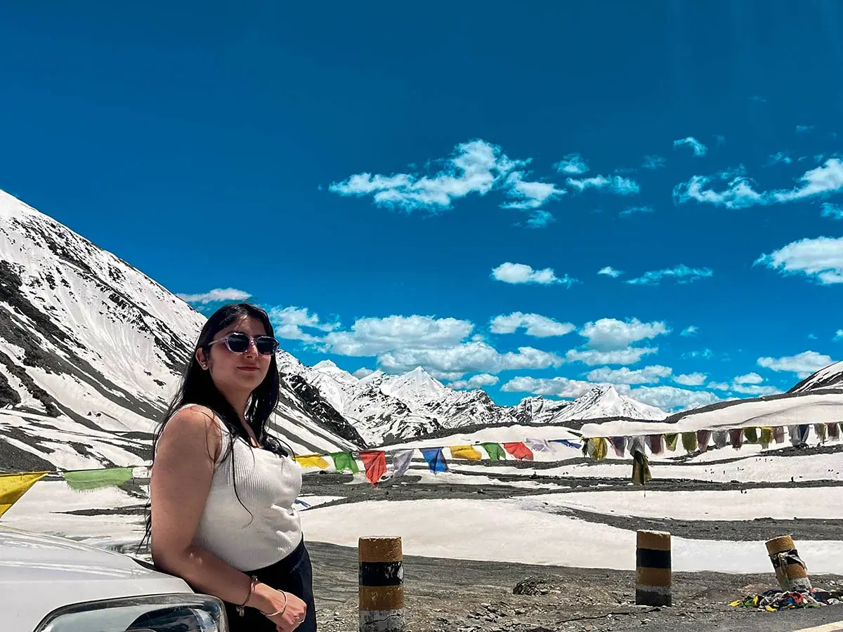 🌨️ High-altitude view of Shinku La Pass with snow patches and rugged trail